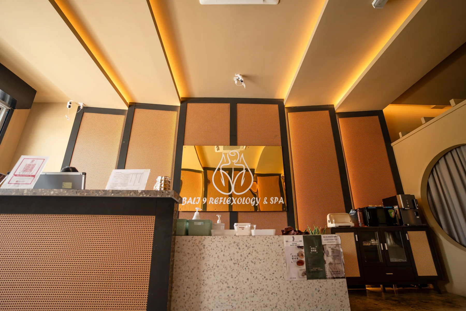 Completed Bali 9 Massage reception counter with warm ceiling lighting